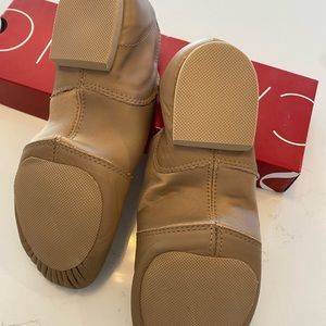 New Capezio jazz shoes, half soles & slightly used jazz shoes. All 3 included.
